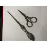 A SILVER HANDLED BUTTON HOOK AND A PAIR OF SILVER HANDLED SISSORS