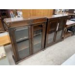 A NEAR PAIR OF EARLY 20TH CENTURY OAK DISPLAY CABINETS ON BUN FEET, 37.5" WIDE EACH, 12" DEEP