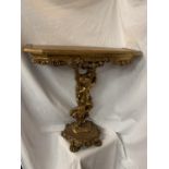 AN ORNATE GILT CONSOLE TABLE IN THE FORM OF A CHERUB H: 76CM