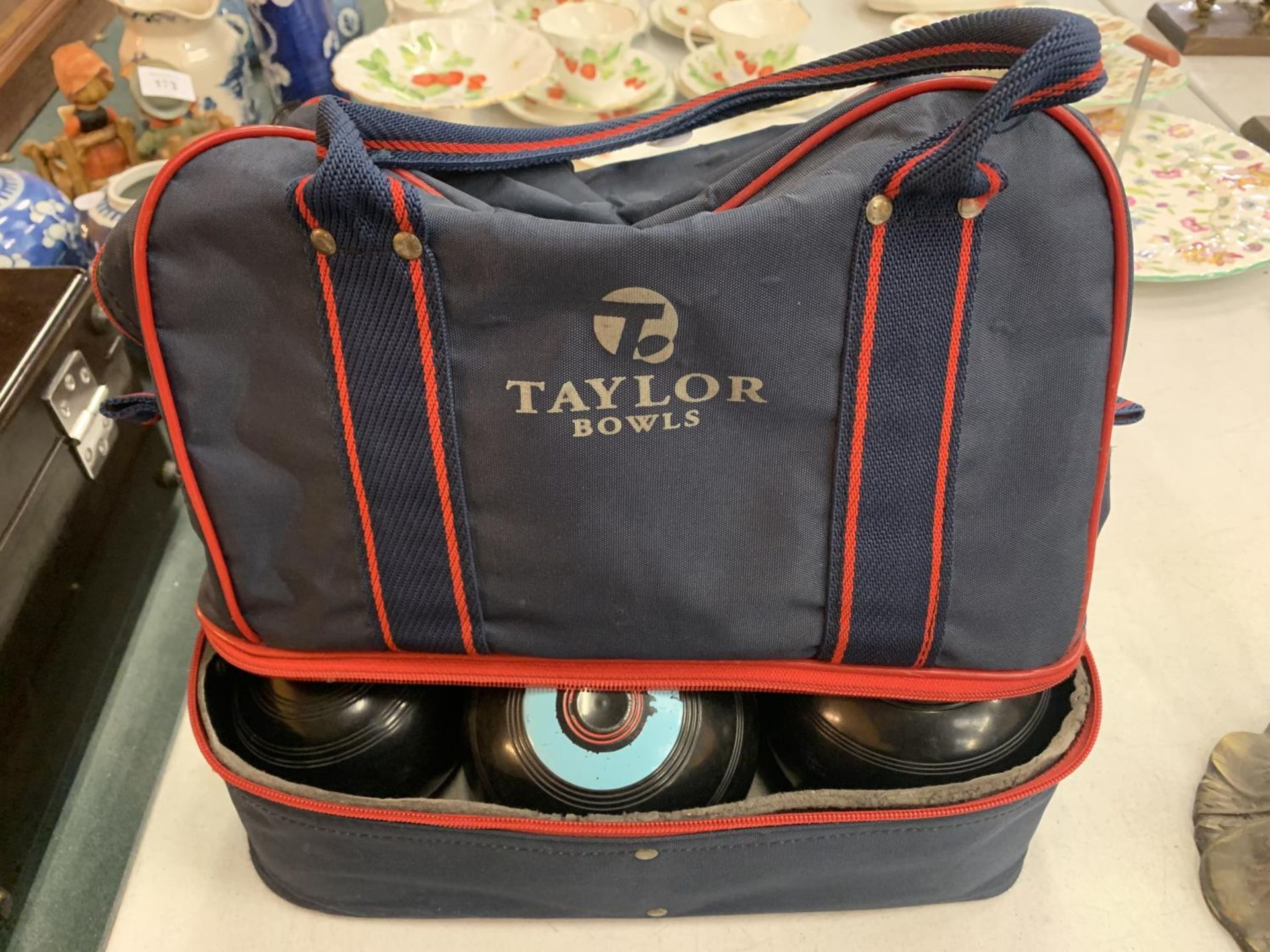 A PAIR OF THOMAS TAYLOR BOWLS AND A JACK BY THE SAME TO INCLUDE A CANVAS CARRY BAG