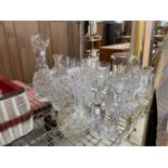 AN ASSORTMENT OF GLASS WARE TO INCLUDE JUGS AND GOBLETS ETC