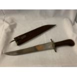 A HARDWOOD HANDLED INDIAN KNIFE TO ALSO INCLUDE THE CARVED WOODEN CASE L: 39CM