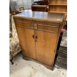 AN EARLY 20TH CENTURY SMALL TWO DOOR OAK WARDROBE, 32" WIDE