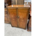 AN EARLY 20TH CENTURY WALNUT CABINET WITH TWO DOORS - 33" WIDE