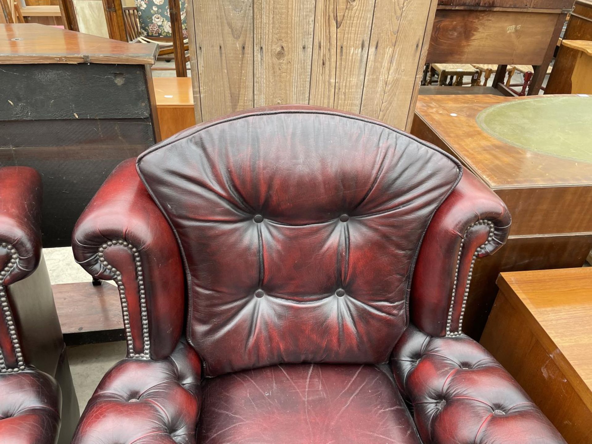 TWO OXBLOOD LEATHER ARMCHAIRS WITH BUTTONED BACK AND ARMS - Image 5 of 7