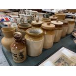 TEN LARGE EARTHENWARE POTS, FOUR WITH LIDS, A STONEWARE JUG AND A SMALL 'HARVEST SCRUMPY' FLAGON