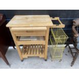 A KITCHEN ISLAND ON WHEELS AND A VEG RACK