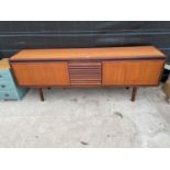 A RETRO TEAK SIDEBOARD, 82" WIDE, ENCLOSING TWO CUPBAORDS AND THREE DRAWERS WITH LOUVRE EFFECT