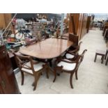 A REGENCY STYLE MAHOGANY AND INLAID EXTENDING DINING TABLE AND SIX CHAIRS
