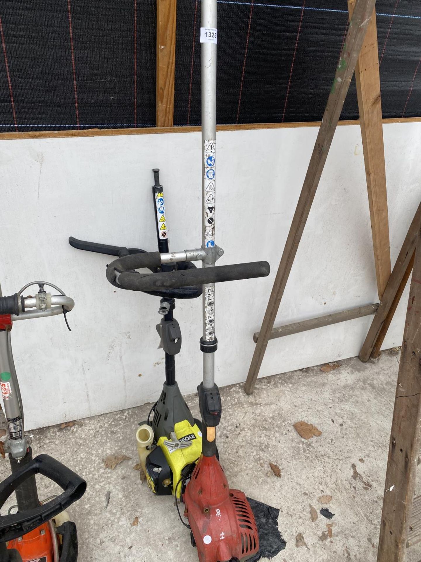 A HOMELITE STRIMMER AND A RYOBI STRIMMER