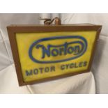 AN ILLUMINATED 'NORTON MOTOR CYCLES' SIGN