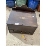 A VINTAGE STORAGE BOX WITH UPPER LIFTING LID AND THREE SMALL DRAWERS