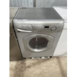 A GREY HOTPOINT WASHING MACHINE BELIEVED WORKING BUT NO WARRANTY