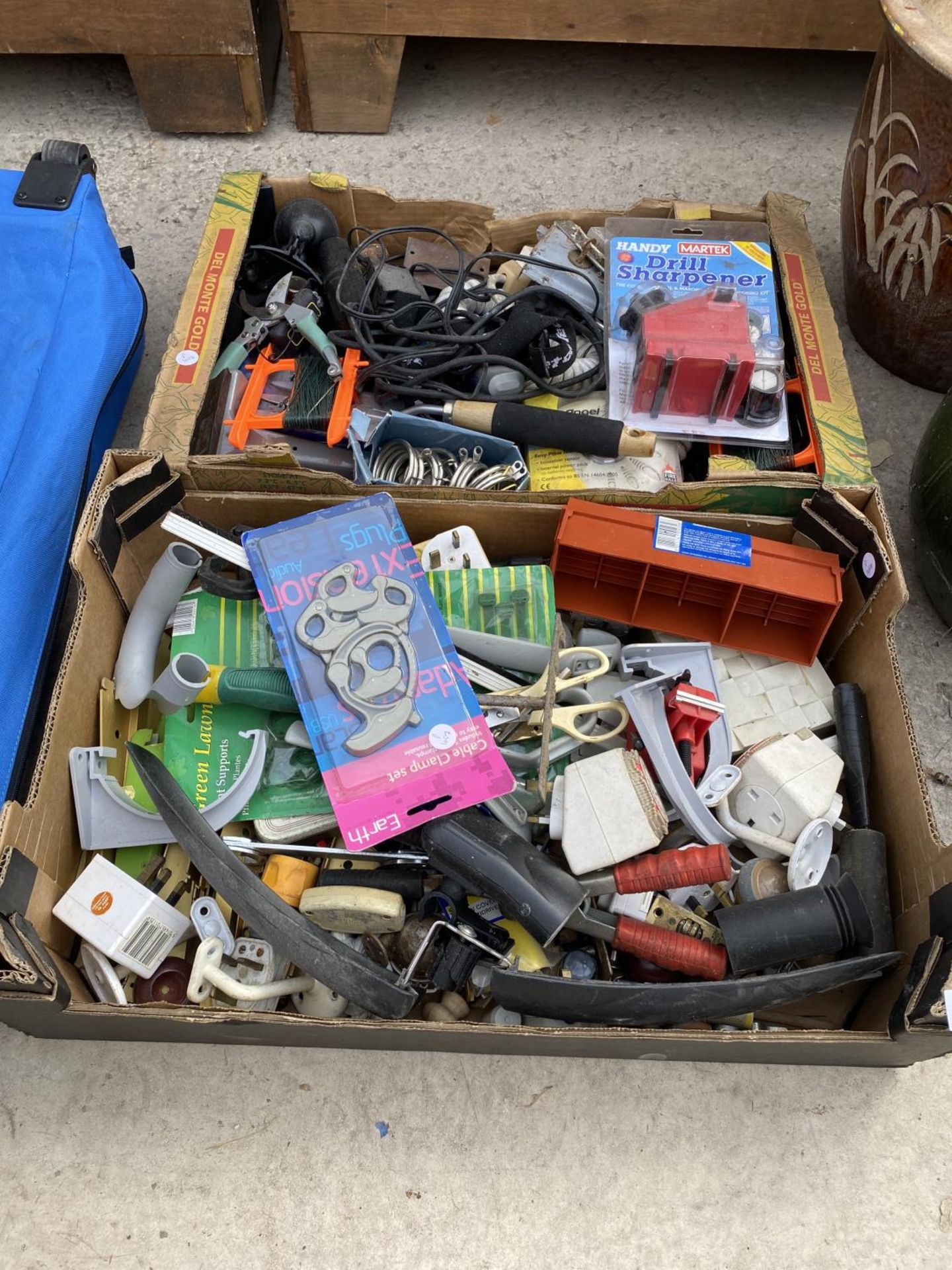 AN ASSORTMENT OF TOOLS AND HARD WARE ITEMS TO INCLUDE A DRILL SHARPENER AND HOOKS ETC