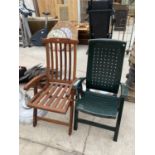 A TEAK RECLINING GARDEN CHAIR AND A FURTHER PLASTIC GARDEN CHAIR