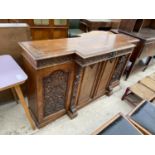 A VICTORIAN HEAVILY CARVED OAK AND CROSSBANDED BREAK FRONT SIDEBOARD WITH FOUR CUPBOARDS TO BASE 66"