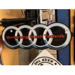 A METAL 'VORSPRUNG DURCH TECHNIK' SIGN - 62CM X 22CM