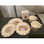 SIX PIECES OF ROYAL DOULTON BUNNYKINS INCLUDING THREE PLATES , TWO CUPS AND A MONEYBOX
