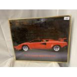 A MODERN GILT FRAMED PRINT OF A LAMBORGHINI