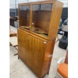 A MID 20TH CENTURY TEAK TWO DOOR STORAGE CABINET