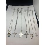 SIX SILVER NECKLACES WITH VARIOUS PENDANTS TO INCLUDE CROSSES