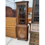 A MAHOGANY CORNER CUPBOARD