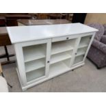 A MODERN WHITE SIDEBOARD ENCLOSING GLAZED CUPBOARDS AND OPEN SHELVES, 57" WIDE