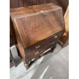 AN EARLY 20TH CENTURY OAK BUREAU, 29" WIDE