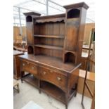 A GEORGIAN STYLE OAK DRESSER COMPLETE WITH PLATE RACK, TWO DRAWERS AND POT BOARD TO BASE W: 65"