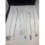 SIX SILVER NECKLACES TO INCLUDE FOUR WITH HEART PENDANTS