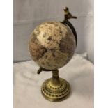 A WORLD GLOBE ON A METAL BASE