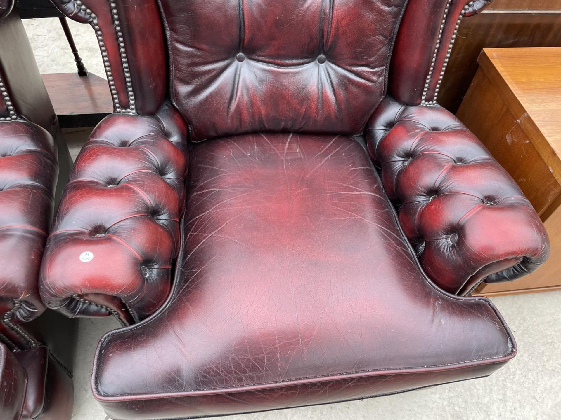 TWO OXBLOOD LEATHER ARMCHAIRS WITH BUTTONED BACK AND ARMS - Image 6 of 7