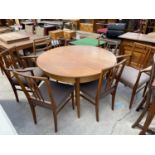 A GORDON RUSSELL RETRO TEAK DINING TABLE, 46" DIAMETER (LEAF 15") AND SIX CHAIRS BEING CARVER