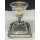 A HALLMARKED SHEFFIELD SQUARE CANDLESTICK WITH WEIGHTED BASE