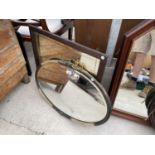 AN OVAL BEVELED EDGE MIRROR AND A FURTHER WOODEN FRAMED MIRROR