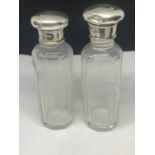 TWO HALLMARKED SILVER TOPPED GLASS BOTTLES ONE WITH GLASS A/F
