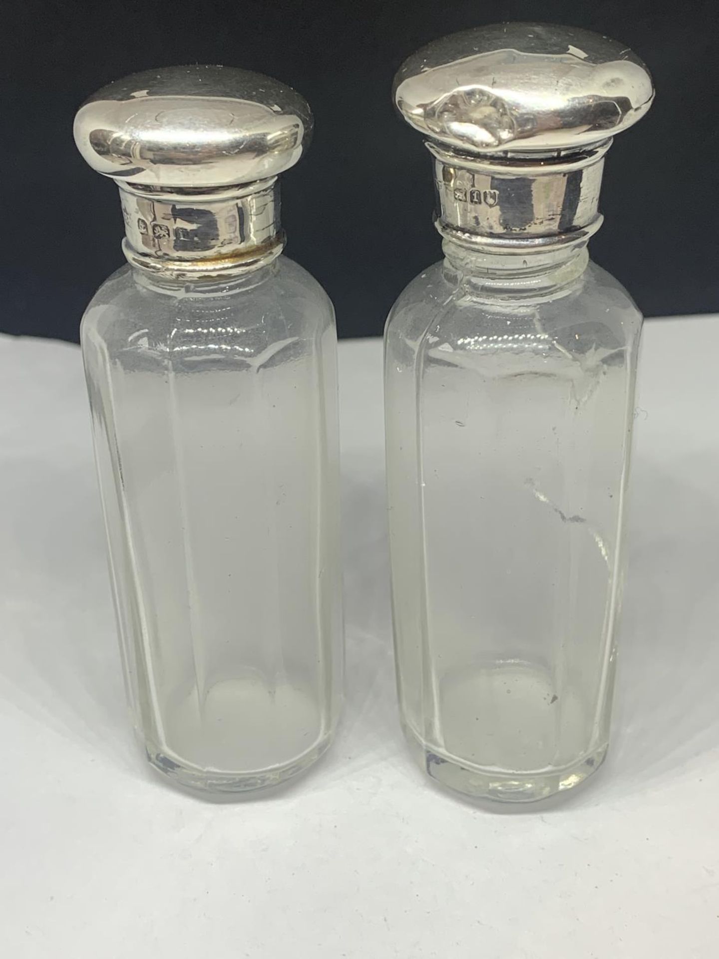 TWO HALLMARKED SILVER TOPPED GLASS BOTTLES ONE WITH GLASS A/F