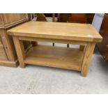 A MODERN OAK EFFECT TABLE L:35" W:21"