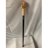 A SKULL HANDLE WALKING STICK