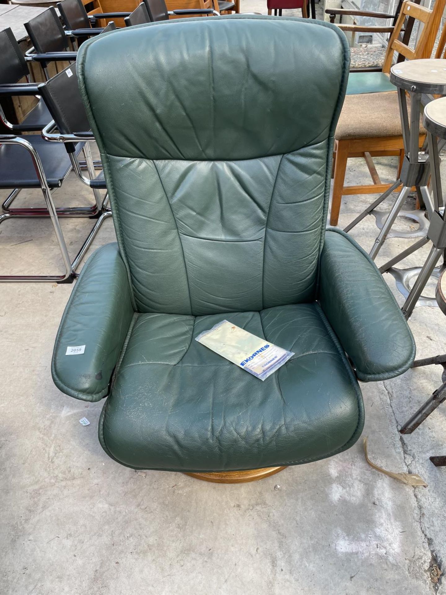 A GREEN EKORNES STRESSLESS CHAIR