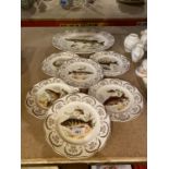 A COLLECTION OF BONE CHINA PLATES WITH SERVING PLATES DEPICTING IMAGES OF FISH