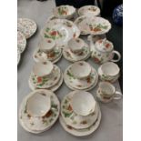 A QUEENS 'VIRGINIA STRAWBERRY' TEA SET TO INCLUDE SIX TRIOS, A SANDWICH PLATE AND A COMPORT ETC