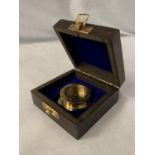 A BOXED 'HENRY HUGHES' BRASS COMPASS
