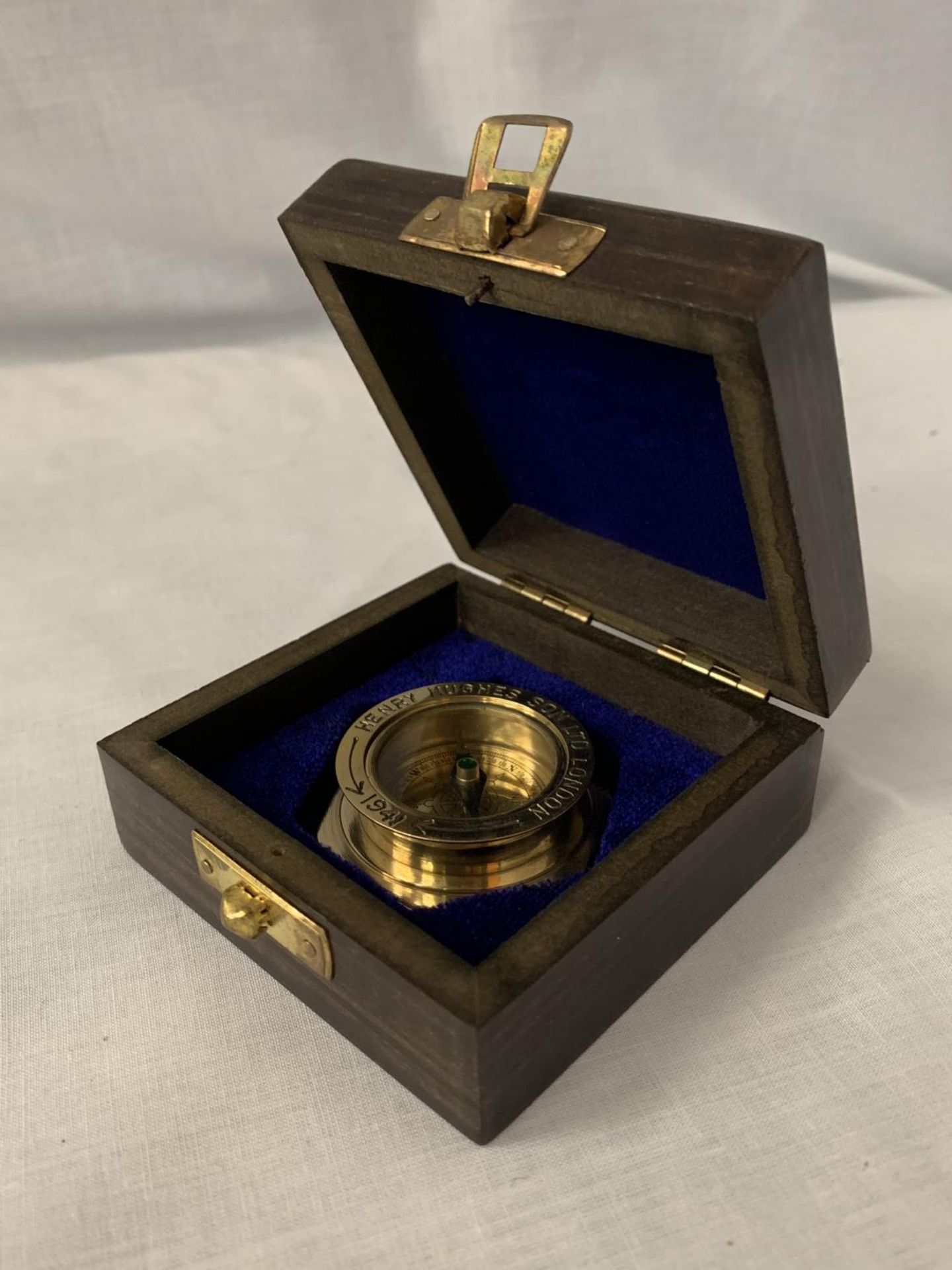 A BOXED 'HENRY HUGHES' BRASS COMPASS