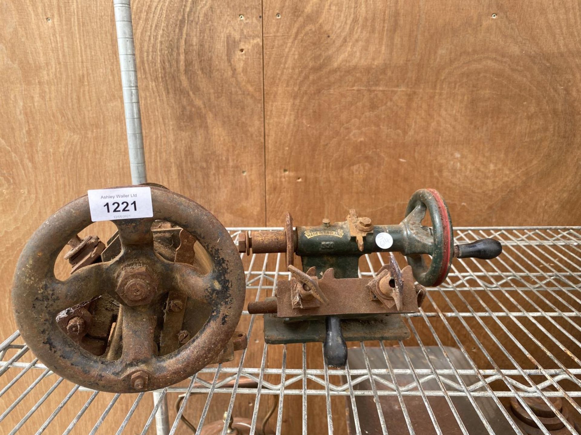 A VINTAGE LATHE HANDLE AND PULLEY SYSTEM