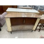 A MID 20TH CENTURY SOBELL RADIOGRAM WITH A PAIR OF TAMBOUR DOORS, ON BLACK TAPERED LEGS, 48" WIDE