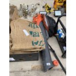 A FLYMO 2500W GARDEN VAC AND A QUANTITY OF HESSIAN BAGS