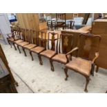 A SET OF EIGHT GEORGIAN STYLE WALNUT DINING CHAIRS, BEARING WARING & GILLOW LABEL, ON CABRIOLE