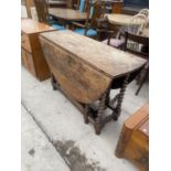 A GEORGIAN OVAL GATE LEG DINING TABLE ON BARLEY TWIST LEGS AND ONE END DRAWER 56 INCHES X 47 INCHES