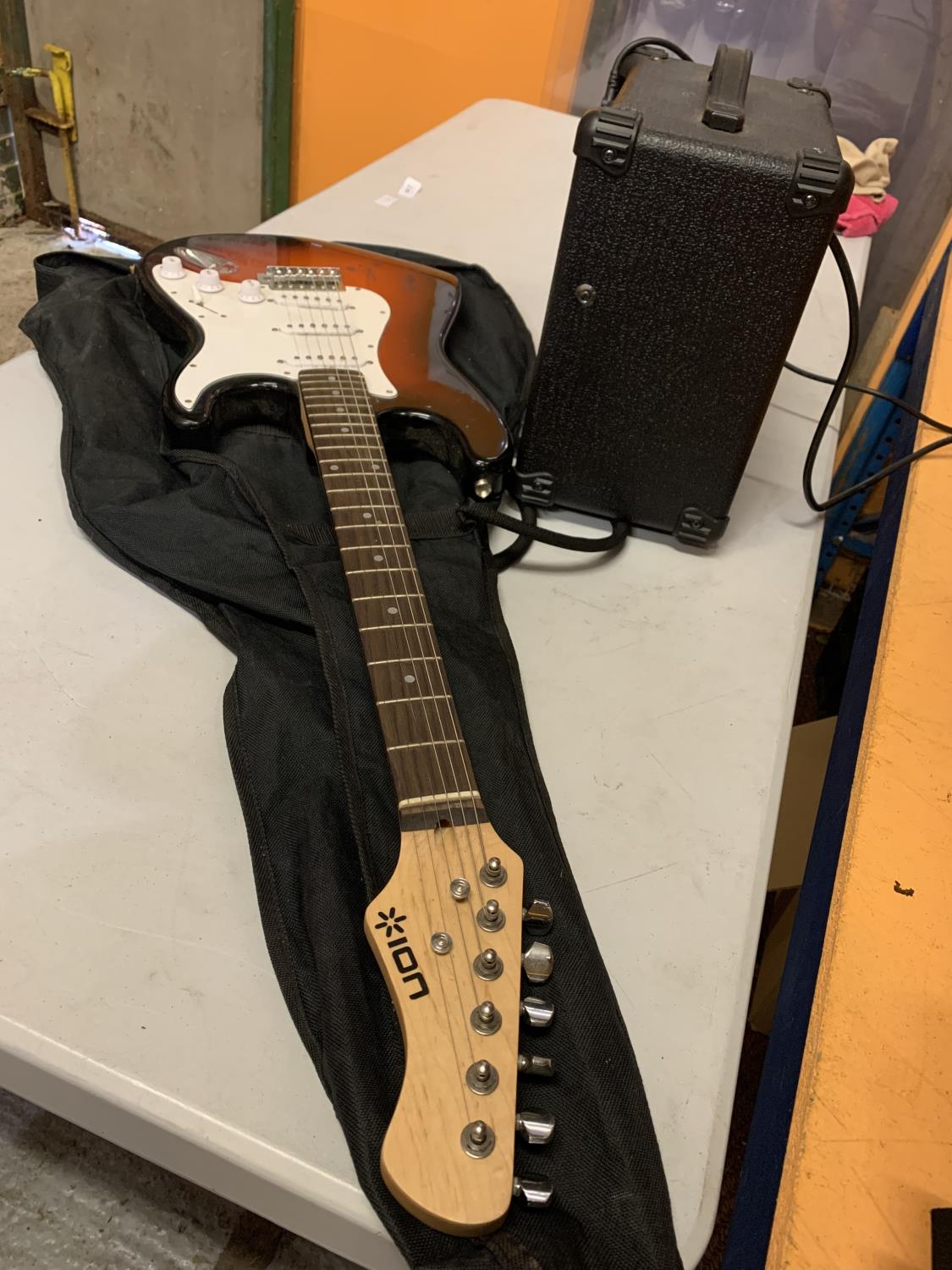 AN ION ELECTRIC GUITAR WITH CARRYING CASE AND AMPLIFIER - Image 5 of 5